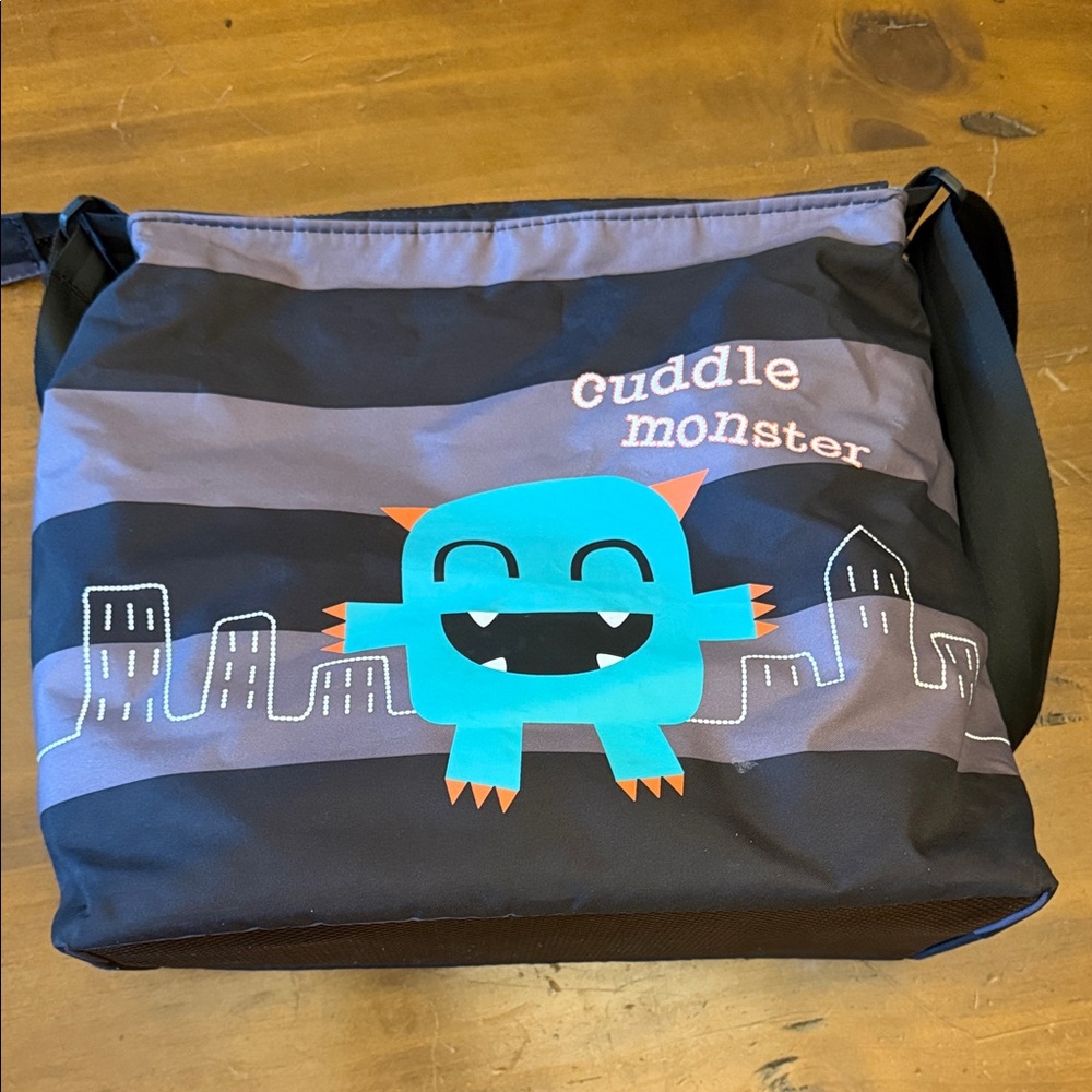 Cosatto Cuddle Monster Shoulder Bag with changing pad and wet dry bag
